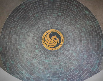 Circular tile floor featuring the UCF Pegasus logo

